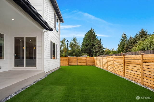 view of yard with a patio area