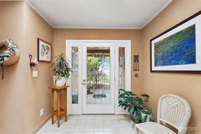 entrance foyer with baseboards and crown molding