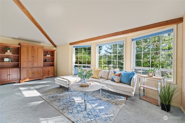 living room featuring high vaulted ceiling, plenty of natural light, and light carpet