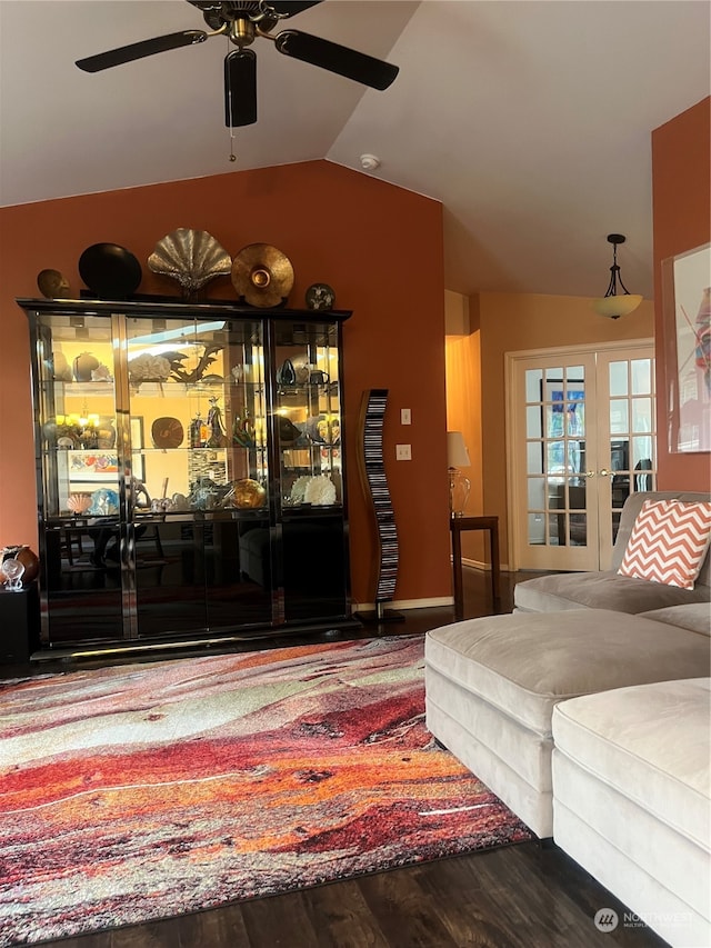 living room with ceiling fan, hardwood / wood-style flooring, french doors, and vaulted ceiling