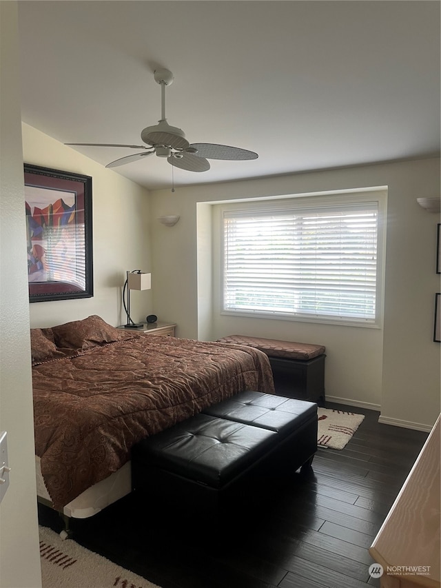 bedroom featuring ceiling fan and dark hardwood / wood-style flooring