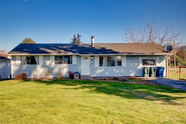 ranch-style house with a front lawn