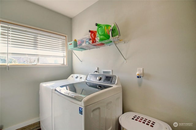 washroom with washing machine and clothes dryer