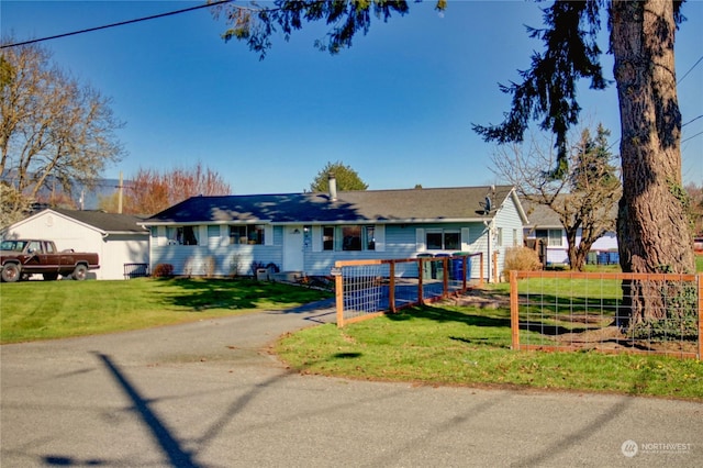 ranch-style home featuring a front yard