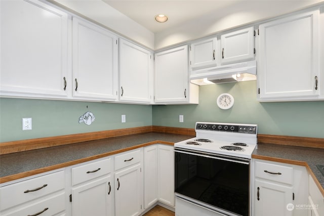 kitchen featuring white cabinets and white range with electric stovetop