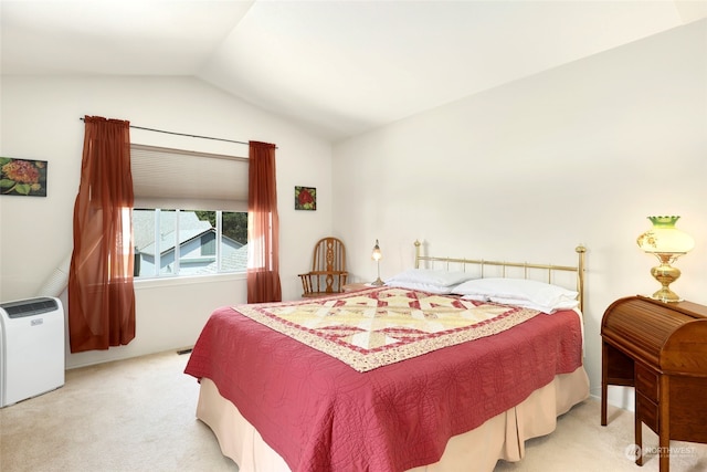 bedroom with light carpet and vaulted ceiling