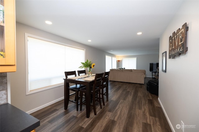dining room featuring baseboards, recessed lighting, and dark wood-style flooring