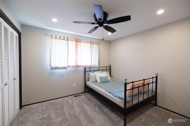 unfurnished bedroom with a closet, carpet floors, visible vents, and recessed lighting