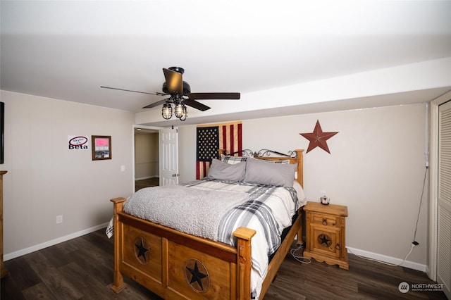 bedroom with a ceiling fan, baseboards, and dark wood finished floors