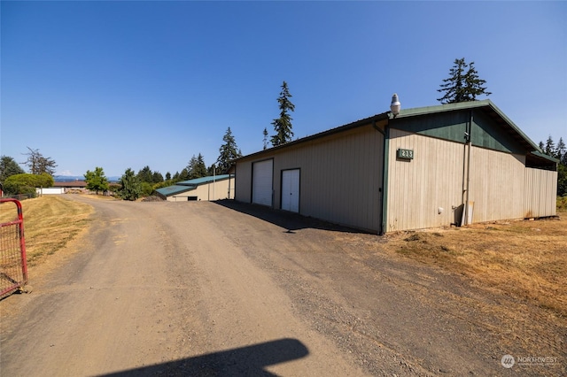 exterior space with dirt driveway
