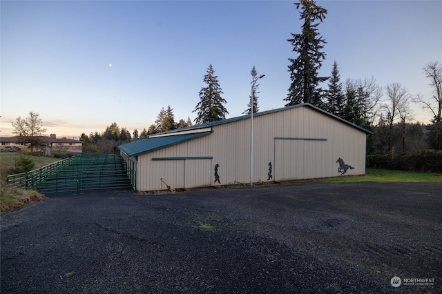 view of pole building with driveway