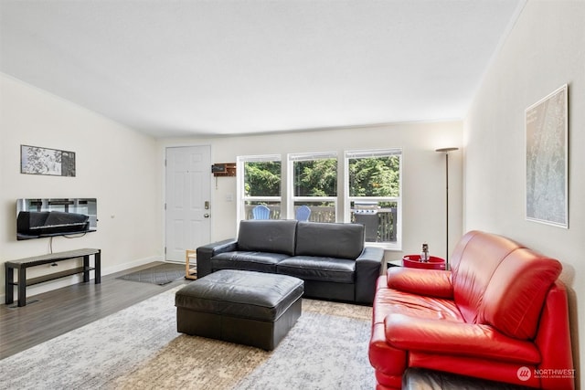 living area with wood finished floors and baseboards