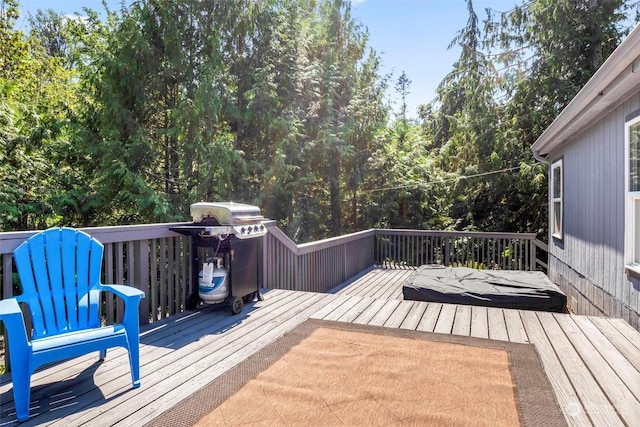 wooden terrace featuring area for grilling