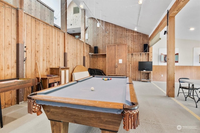 rec room with carpet floors, vaulted ceiling, wood walls, and billiards