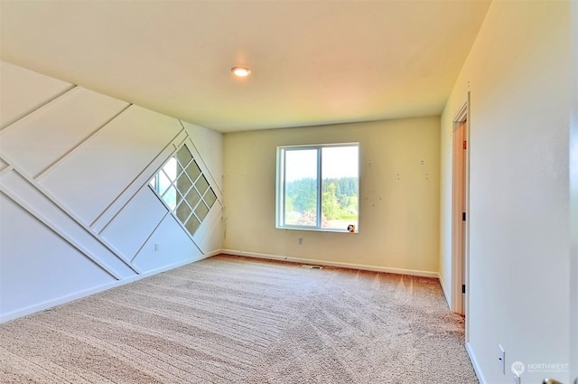 empty room featuring carpet flooring