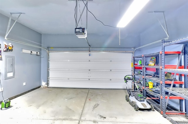 garage featuring a garage door opener and electric panel