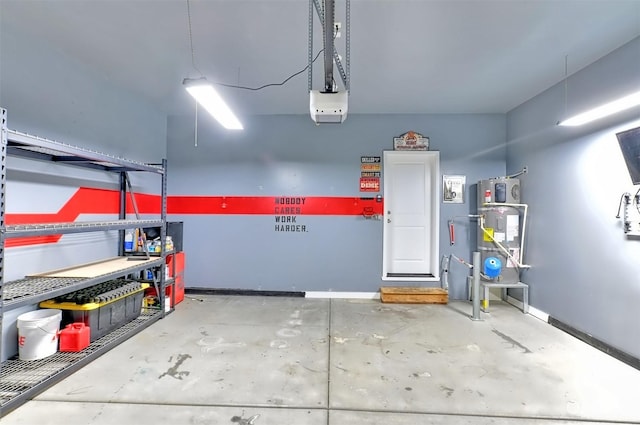 garage featuring a garage door opener and strapped water heater