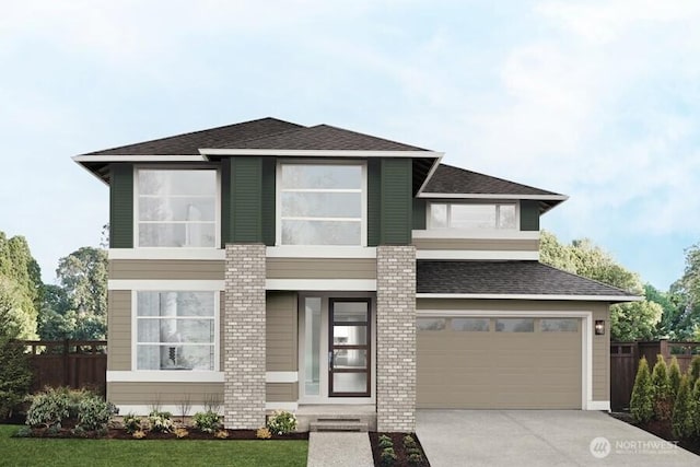 prairie-style home featuring concrete driveway, roof with shingles, a garage, and fence