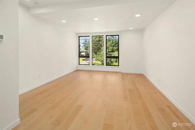 spare room featuring light wood-type flooring