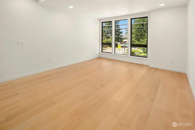 spare room with light hardwood / wood-style floors