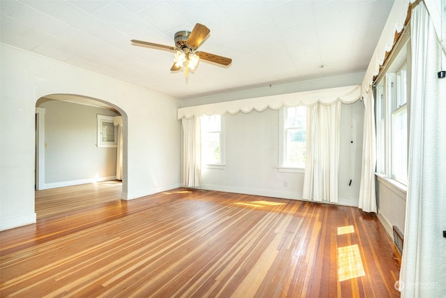 spare room featuring hardwood / wood-style floors and ceiling fan