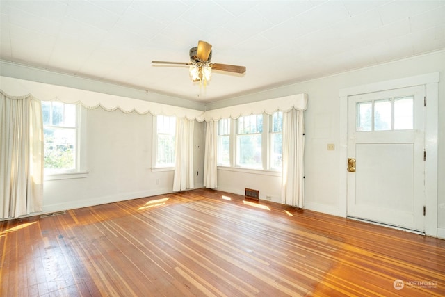 foyer featuring wood-type flooring and ceiling fan