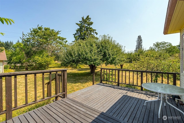 deck featuring a lawn