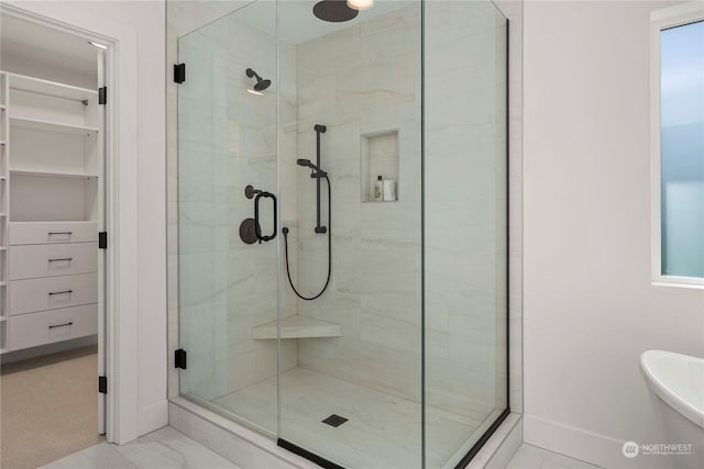 bathroom with a shower with shower door