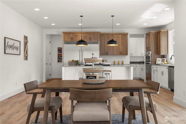 dining room with light hardwood / wood-style floors