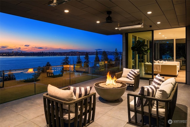 3263 Evergreen Point Rd, Medina, WA 98039 - view of patio / terrace featuring a water view and an outdoor living space with a fire pit