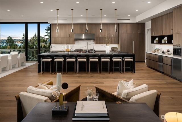 3263 Evergreen Point Rd, Medina, WA 98039 - living area with light wood-style flooring and recessed lighting