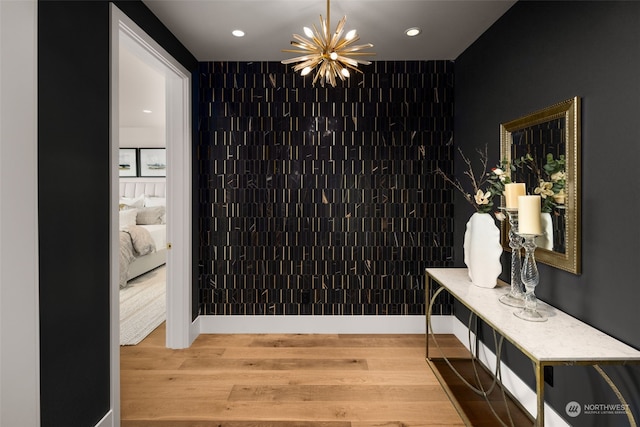 3263 Evergreen Point Rd, Medina, WA 98039 - corridor featuring a chandelier, wood finished floors, and recessed lighting