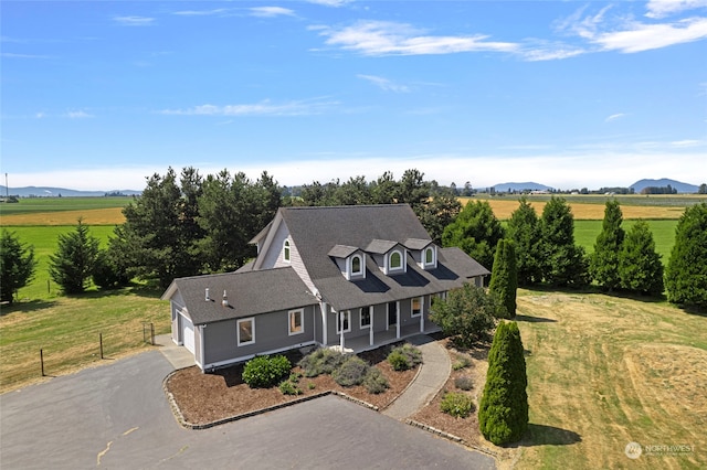 birds eye view of property with a rural view