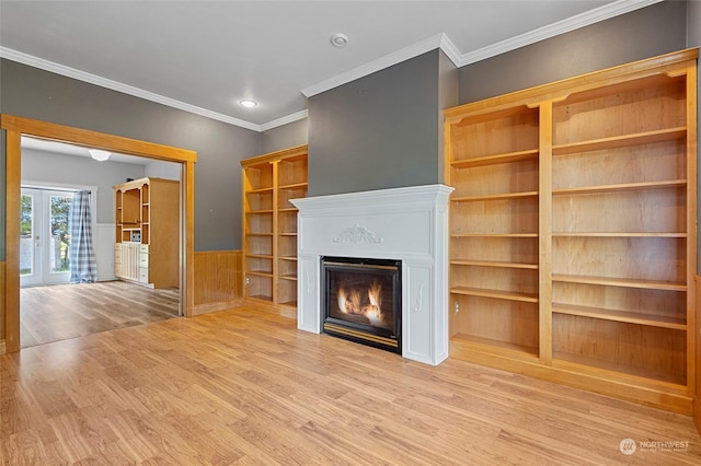 6340 Chuckanut Dr, Bow, WA 98232 - unfurnished living room featuring wood finished floors, ornamental molding, a glass covered fireplace, and a wainscoted wall