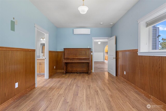 interior space with connected bathroom and light hardwood / wood-style flooring