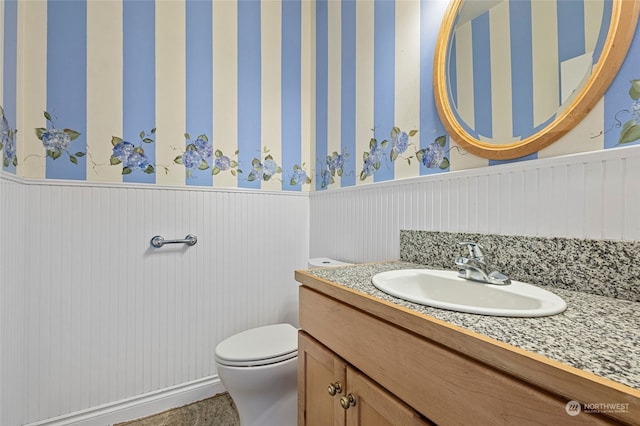 bathroom with vanity and toilet