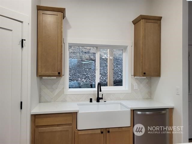 433 SE Stacy Dr, Moses Lake, WA 98837 - kitchen featuring tasteful backsplash, stainless steel dishwasher, and sink