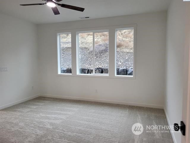 433 SE Stacy Dr, Moses Lake, WA 98837 - carpeted spare room with plenty of natural light and ceiling fan