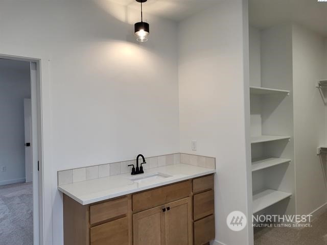433 SE Stacy Dr, Moses Lake, WA 98837 - bathroom with vanity and built in shelves