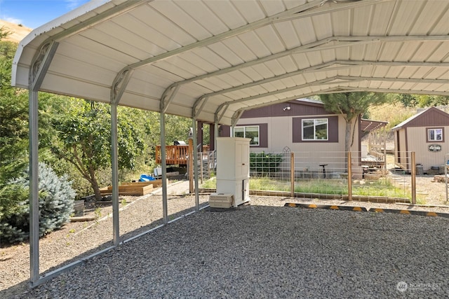 view of vehicle parking featuring a carport