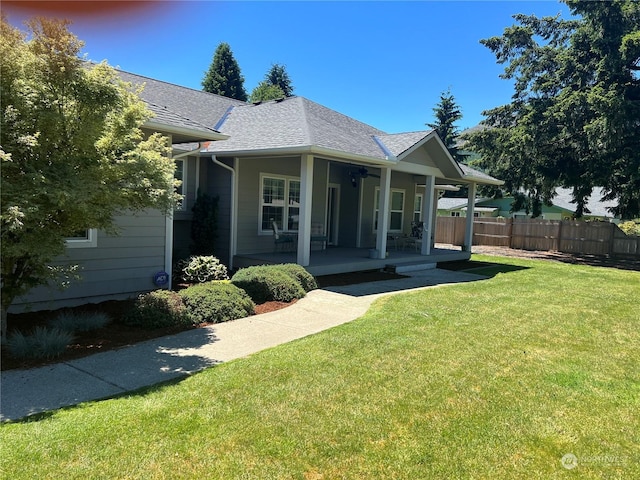 exterior space featuring a porch and a lawn