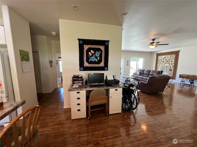 home office featuring dark wood-type flooring and ceiling fan