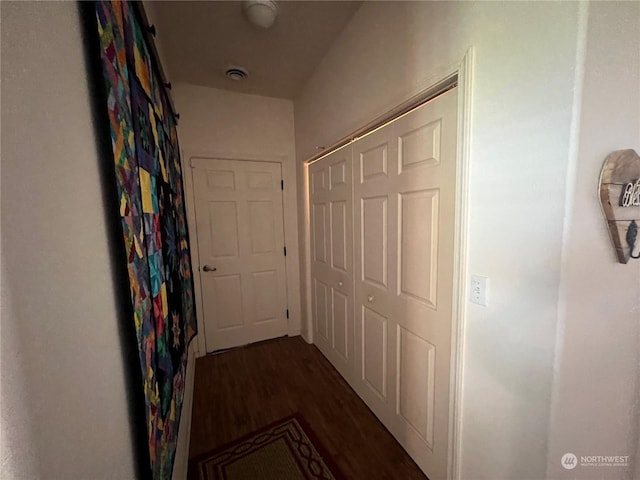 hall with dark hardwood / wood-style flooring