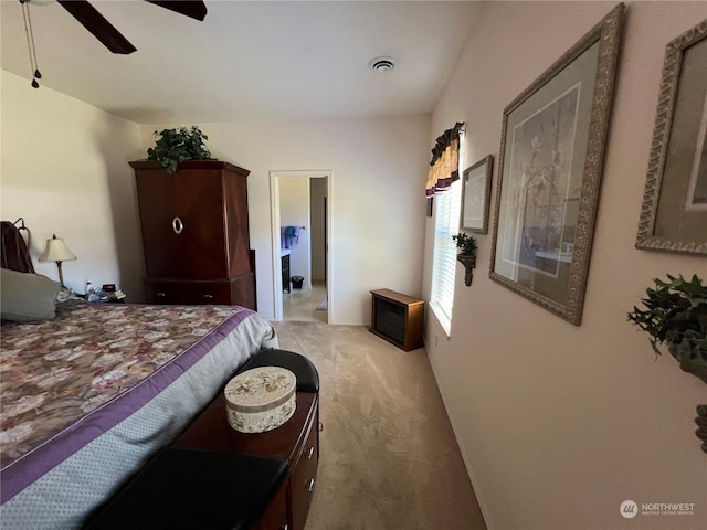 bedroom featuring light colored carpet and ceiling fan