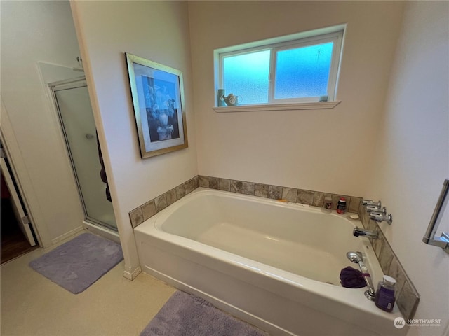 bathroom with separate shower and tub