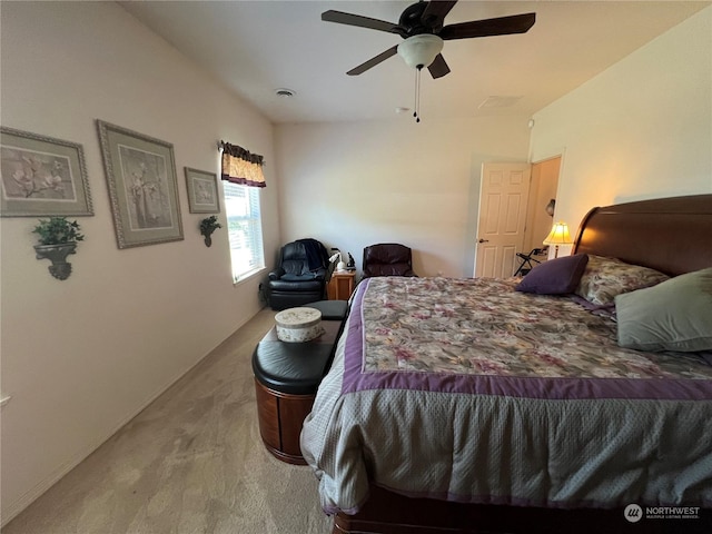 bedroom with ceiling fan, vaulted ceiling, and light carpet