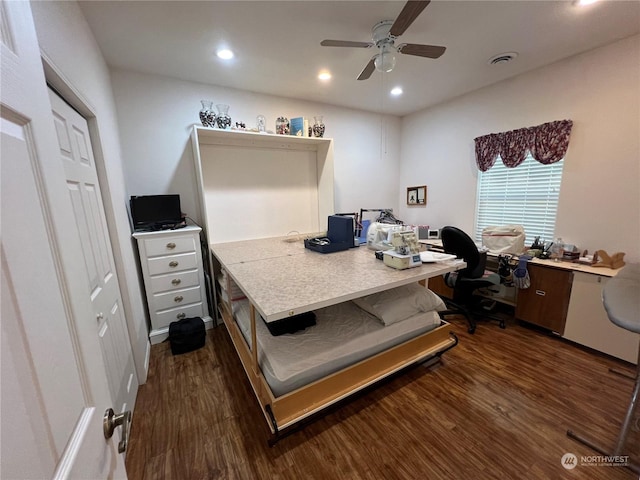 office area with ceiling fan and dark hardwood / wood-style floors