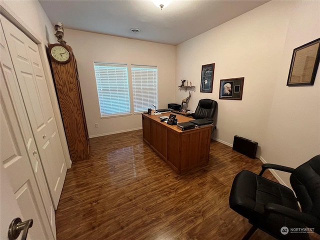 office space with dark wood-type flooring