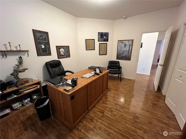 office space with dark hardwood / wood-style flooring