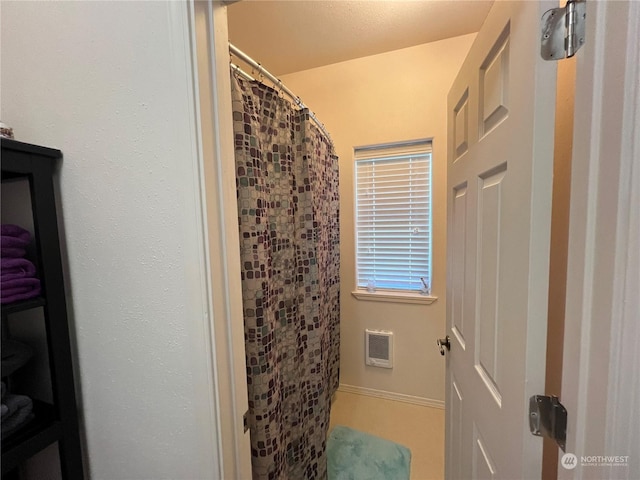 bathroom featuring curtained shower